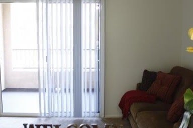 Living Area & Balcony - Serenity Villas Senior Apartments