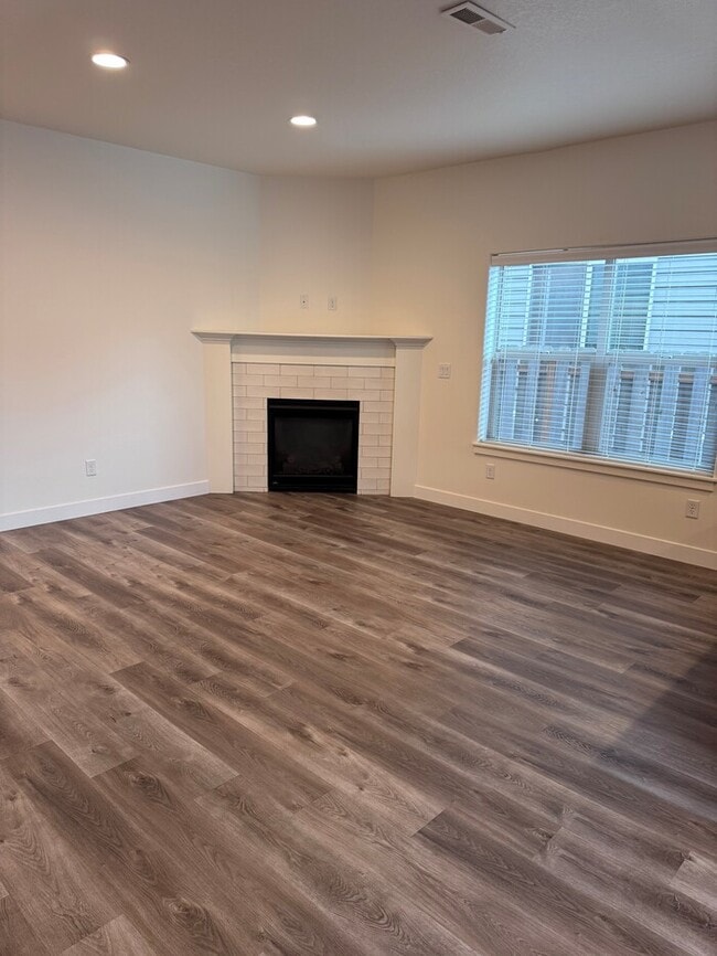 Photo - Beautiful Home with LVP Flooring, SS Appliances, Garage, W/D, Fenced Yard, LARGE Master & MORE!