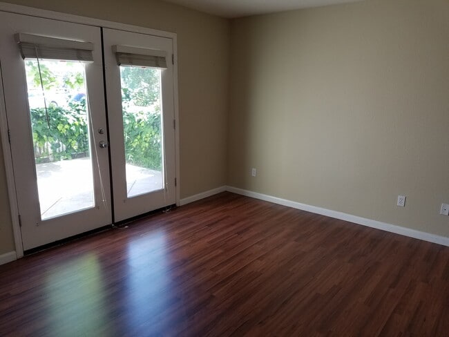 The bottom floor room has beautiful french doors that open up to the patio area. Great for barbecues! - 2878 Hilltop Mall Road Townhome