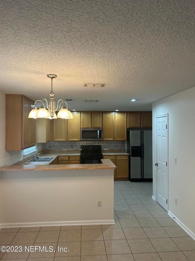 1603 Canopy Oaks Dr