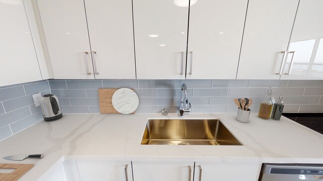 White kitchen counter and sink at 360 Torrance. - 360 Torrance