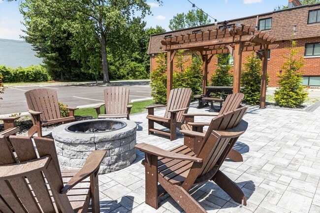Unwind amid the serene outdoor space at Eagle Rock Apartments at Hudson. Enjoy cozy gatherings around the fire pit, surrounded by lush greenery and inviting seating. Elevate your lifestyle today—schedule your tour now!
