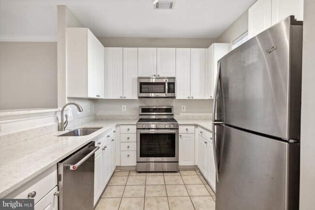 Photo - This townhouse style condo is located across the street from the Vienna Metro Station (Orange Line).