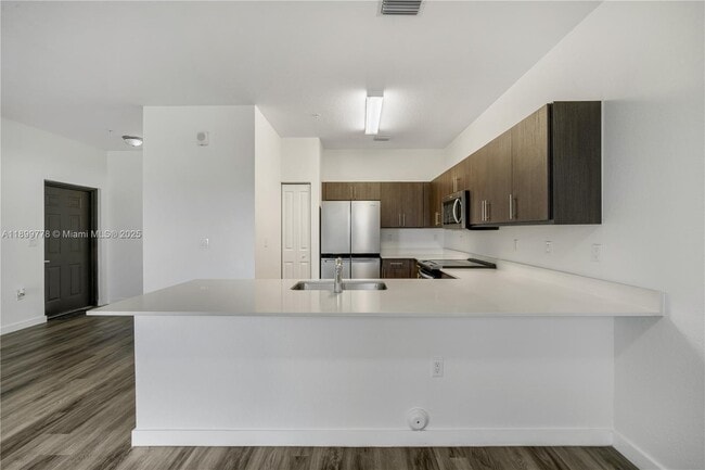 Building Photo - 15500 SW 136th St Unit 103
