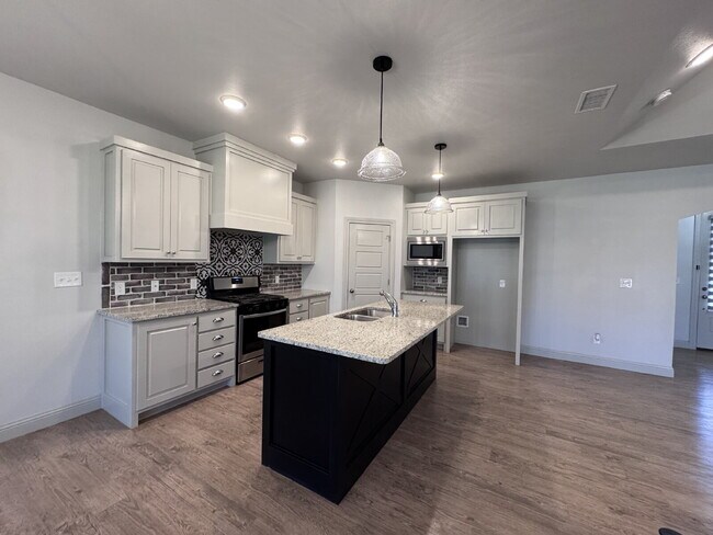 Photo - Stunning 4-Bed Home with Cozy Fireplace!