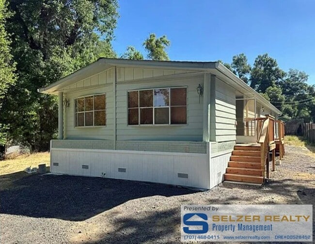 Building Photo - Roomy 2 bd. mobile w/ big yard in a countr... Rental