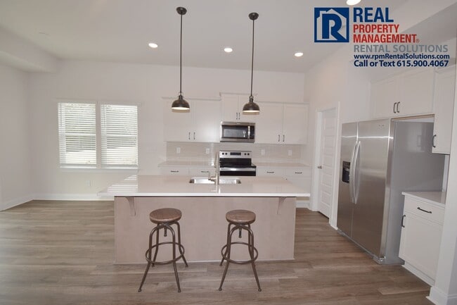 Photo - Gorgeous 4 bd home with attached garage! Neighborhood Pool!