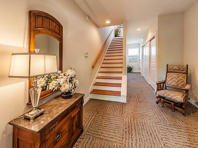 Welcoming entryway with large closets and elevator, to attached garage - 876 Woodruff Place West Drive Apartment Unit Rear