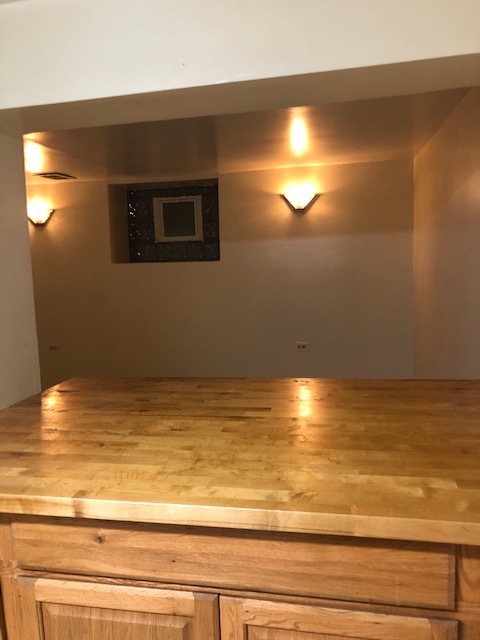 Kitchen with pass through to living area - 5207 N Latrobe Ave Apartments Unit 1