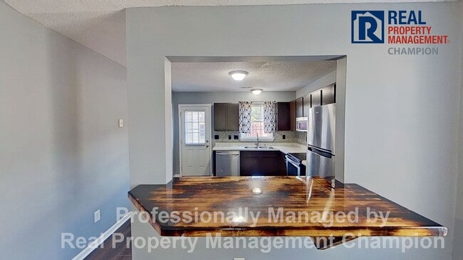 Photo - Charming 2BD/2 BA End Unit Townhouse w/Fireplace and Fenced Backyard