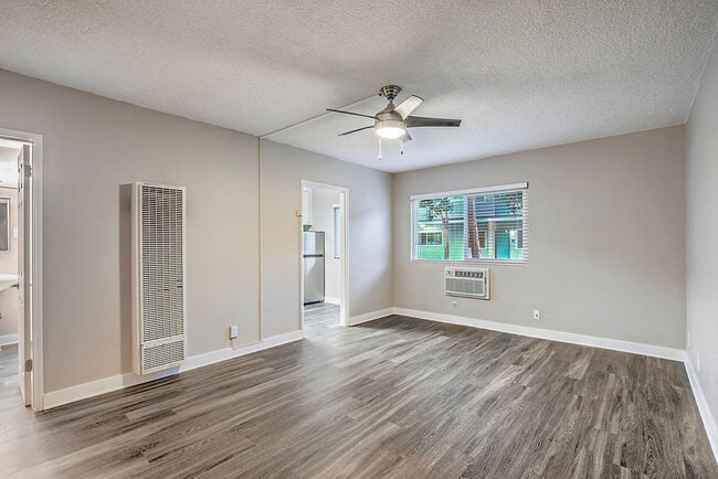 The Island Apartments unfurnished living room and window