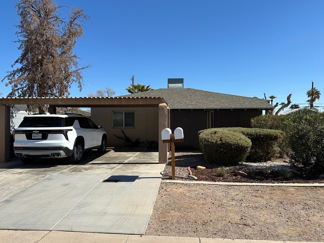 Front of house with two car carport and privacy landscaping/sunshades - 2513 N 28th St (Phoenix, AZ)