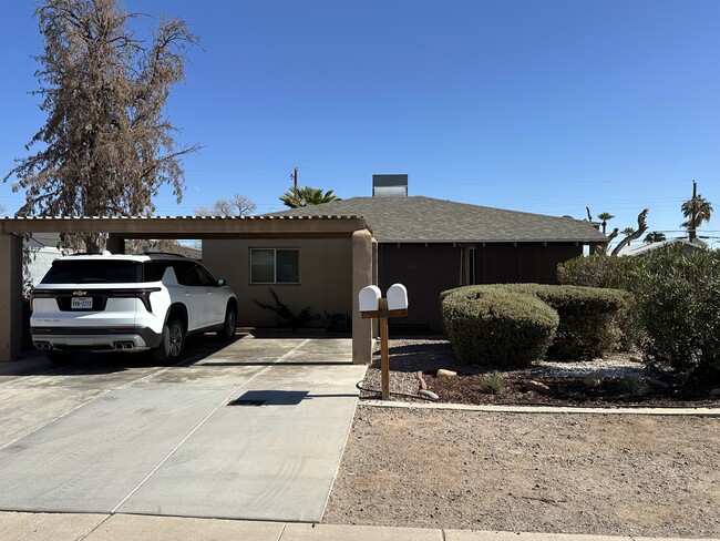 Front of house with two car carport and privacy landscaping/sunshades - 2513 N 28th St House