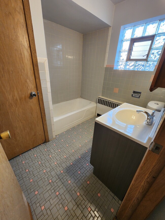 Tub Shower Linen closet - 2624 N 75th Ave Unit Elmwood Apartment