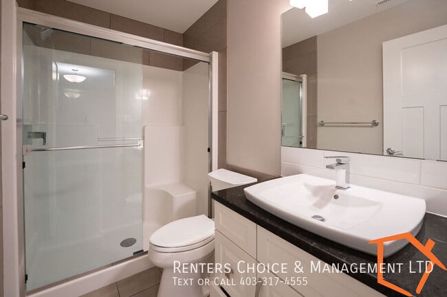 Photo - 2 Bedroom Basement Suite, Insuite Laundry, Assigned Parking