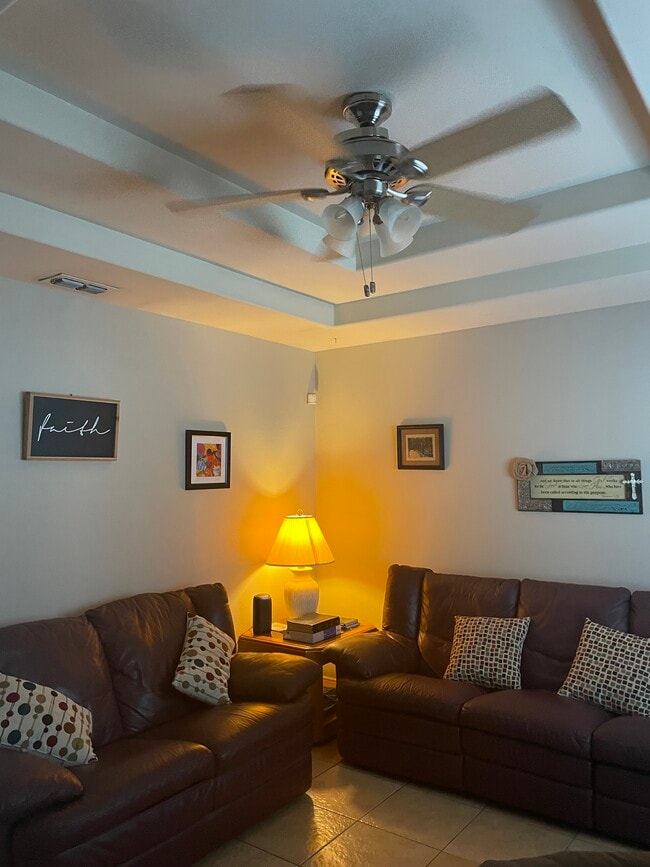 Living Room with ceiling fan - 2607 Ringold Cir Unit B Furnished Apt