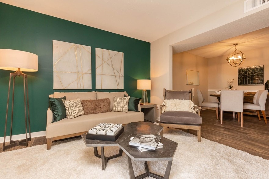 SPACIOUS LIVING ROOM AT MADISON LANDING AT RESEARCH PARK AND THE COTTAGES APARTMENTS