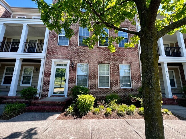 Photo - Elegant three story brick townhome with a ...