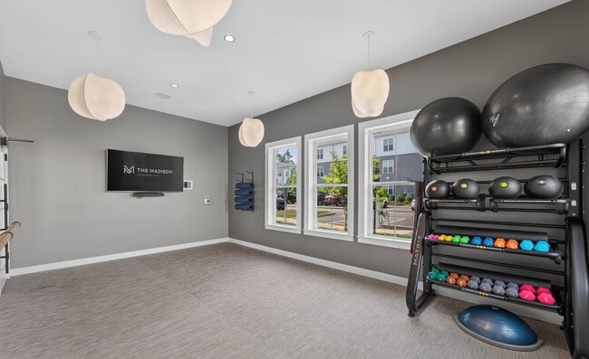 Classes stream to the screen, in a carpeted room away from the weight floor.