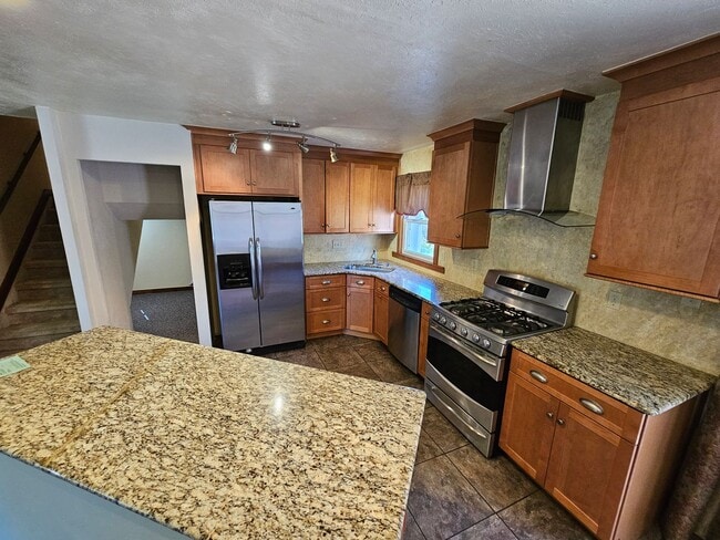 Photo - Charming 3-Bed, 2-Bath Tri-Level Home with Spacious Backyard & Gazebo