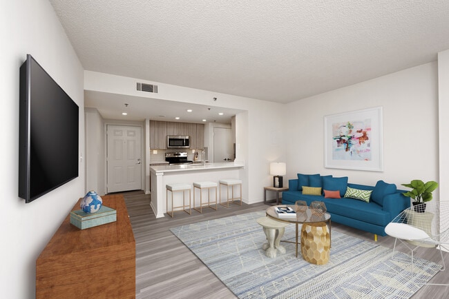 Renovated Package II kitchen, living, and dining areas with hard surface flooring - AVA Ballston Square