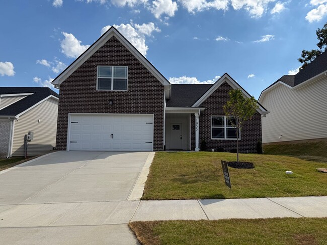 Building Photo - New construction home. 3 bedrooms plus a s...