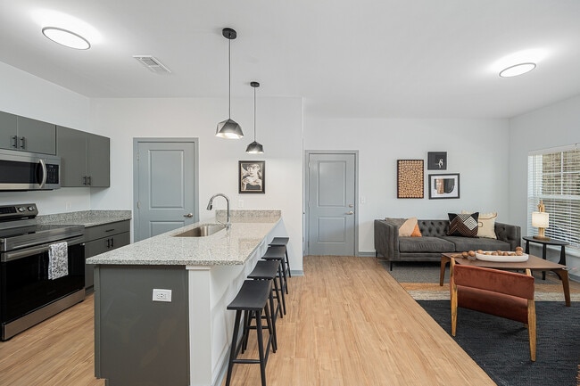 Open Floor Plan Featuring Large Breakfat Bar - The Retreat at Canal Apartments