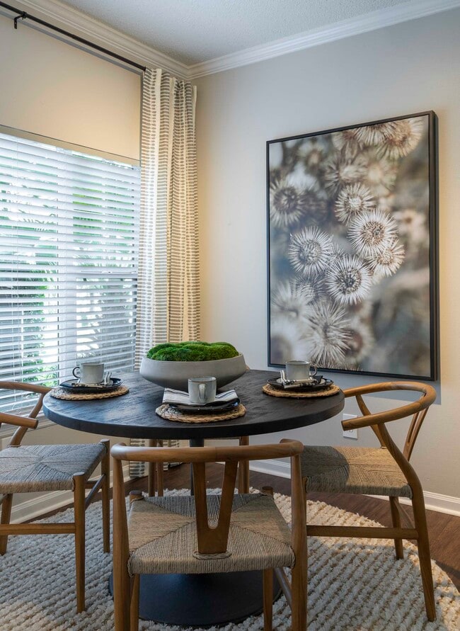 Bright dining area with crown molding
