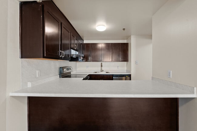 Open kitchens with breakfast bar seating at Mission Main.