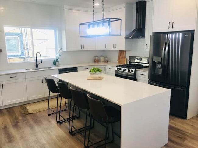 Photo - Beautiful new construction townhouse with quartz countertops and 2 car garage