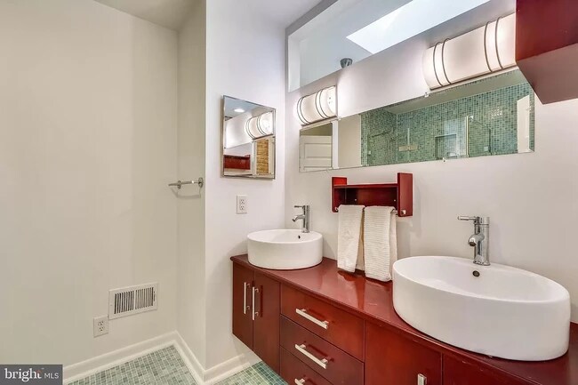 Upstairs bathroom with his and her sinks and shower