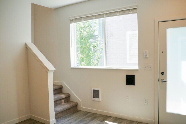 Building Photo - Modern & Sleek One-Bedroom Townhouse Ready... Unit 45-07