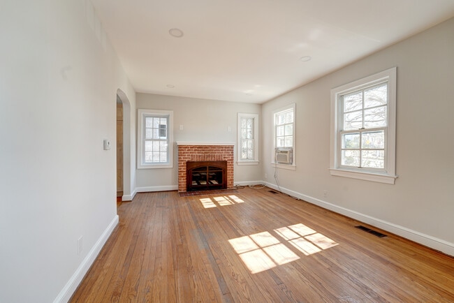 Huge Living Room boasts wood-burning fireplace! - 4607 N Carlin Springs Rd Unit #A