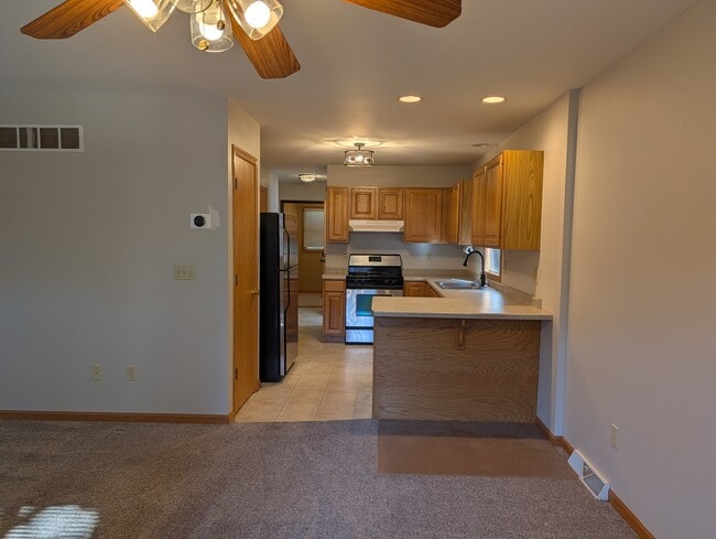 Kitchen 1 with Modern Appliances - 6036 W Mitchell St Unit Upper