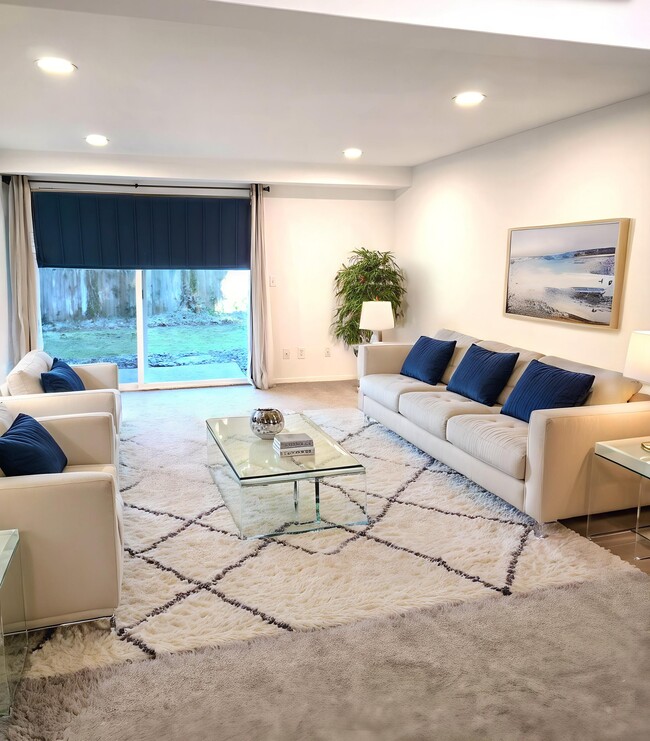 Very large sized living room with a slider to outside patio and gorgeous grounds - 9906 NE 124th St Unit 1111