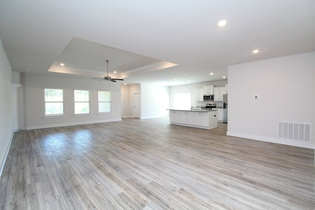 Photo - Don’t Miss This 4BR Home — 3-Car Garage, Modern Interior, Open Layout & Community Pool in Prime 9...