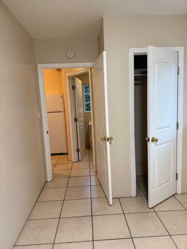 Inside bedroom looking into kitchen. Bedroom closet. - 17526 Horace St Unit Garage attached apartment