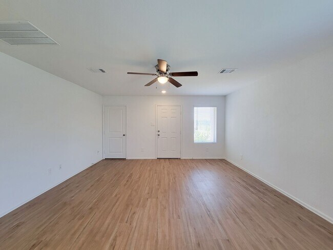 Photo - This single-story home has a comfortable layout with three bedrooms and a living area all on one ...