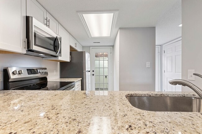 Photo - Master Suite with Balcony!!! Completely remodeled 2 level townhome close to the beaches of Surfside!