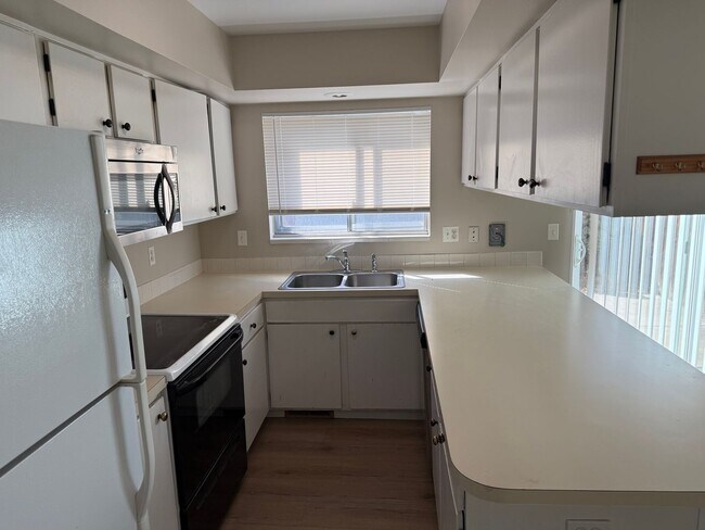 Photo - Spacious 2-bed, 1.5-bath Townhouse-Delivers Comfort & Convenience