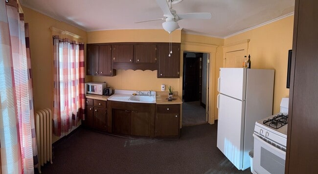 Photo - *NO PET DOGS* Upper 1 bedroom all Utilities included Unit 2 Bed - Front Building - Upper Left