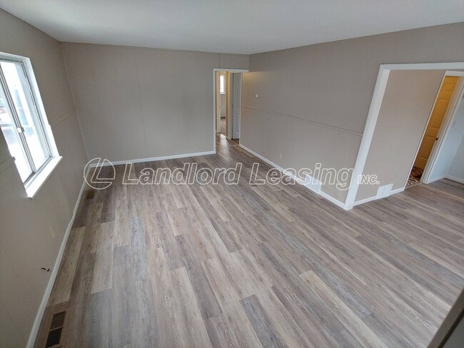 Photo - Freshly painted 3 bedroom with new flooring throughout!