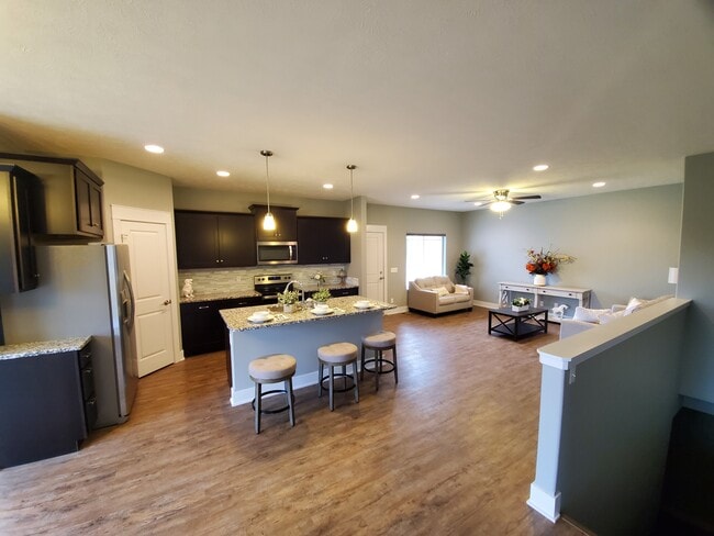 Open living room, kitchen, and dining - 7927 Maxine Drive Unit A