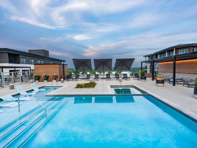 Resort-style rooftop pool with views and plenty of space to unwind or connect.