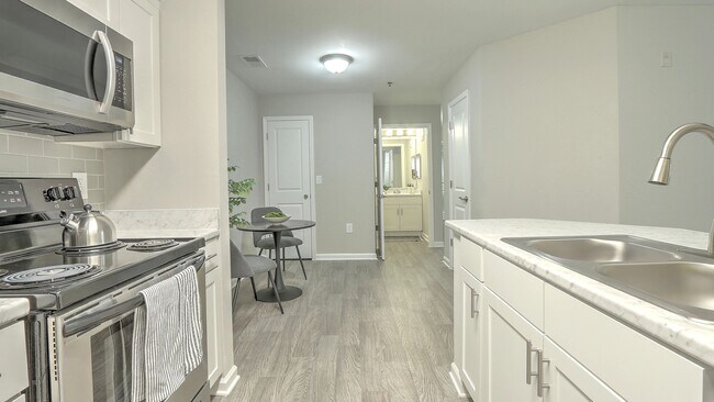 Relish an elegant dining area adjacent to your well-equipped kitchen with an extra storage closet for maximum convenience.