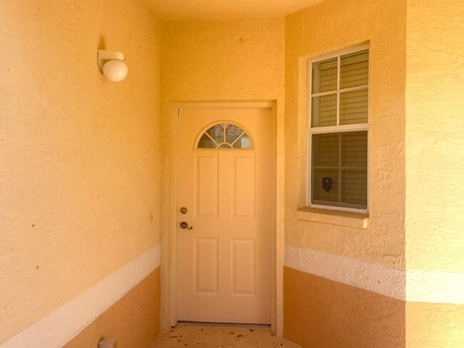 Photo - Elegant 3 Bedroom End-Unit Condo with Screened Lanai & Pond Views and A Private Garage