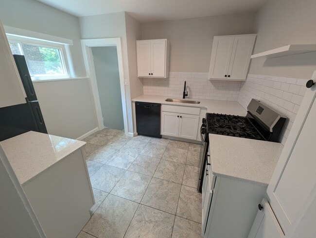 Photo - Beautifully renovated 2 bedroom house with new kitchen, bathroom and 2 car garage.
