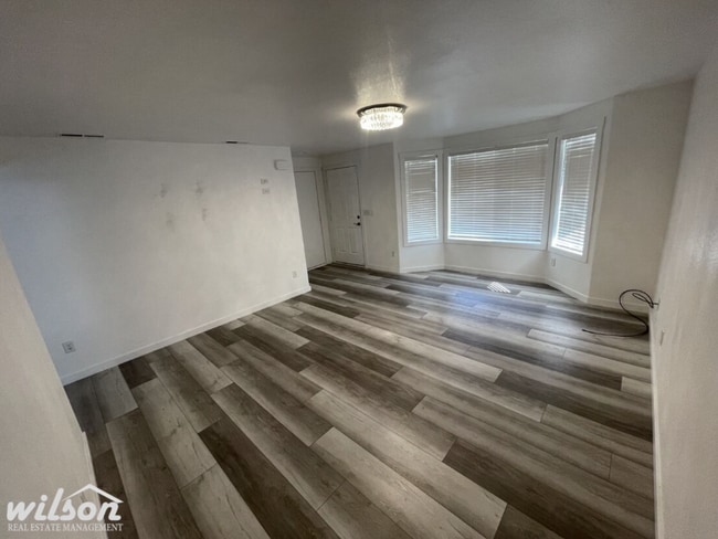 Photo - 3 Bed, 2 Bath Home with a Two-Car Garage, Fenced Backyard, and Lawn Care Included