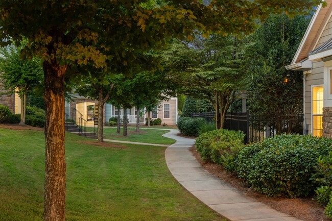 Lush landscaping and modern design create the perfect first impression.
