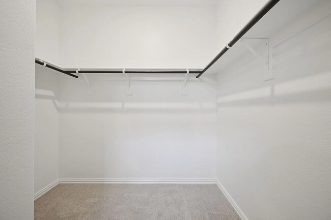 Photo - Stylish 3-bedroom home with modern kitchen, airy living spaces, vaulted primary suite, and elegan...